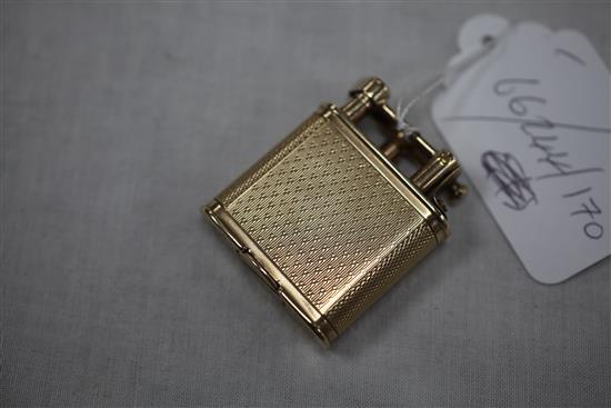 A late 1920s engine turned 9ct gold Dunhill Unique petrol lighter, 1.75in.